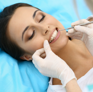young female patient visiting dentist office young female patient visiting dentist office